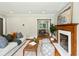 Elegant living room showcasing a fireplace, hardwood floors, and open access to the dining area at 1100 Faith Se Ave, Atlanta, GA 30316