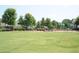 Community playground with lush green space provides a recreational area for residents at 1100 Faith Se Ave, Atlanta, GA 30316