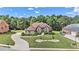 Landscaped home on a wooded lot with a circular driveway at 2628 Hollow Pne, Conyers, GA 30094