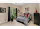 Comfortable bedroom features a stylish bed, blackout curtains, and natural light, creating a restful retreat at 2628 Hollow Pne, Conyers, GA 30094