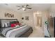 Bright bedroom features a queen-size bed, large window and decorative accents at 2628 Hollow Pne, Conyers, GA 30094