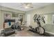 A home gym featuring hardwood floors, mirrors, and an array of workout equipment at 2628 Hollow Pne, Conyers, GA 30094