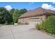 Charming brick home with a spacious driveway and two-car garage provides plenty of parking space at 2628 Hollow Pne, Conyers, GA 30094