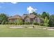 Charming home with mature landscaping and manicured lawn at 2628 Hollow Pne, Conyers, GA 30094