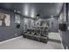 Home theater room with multiple rows of reclining seats, movie posters, and projector at 2628 Hollow Pne, Conyers, GA 30094