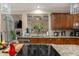 Spacious kitchen features a cooktop island and stainless steel appliances at 2628 Hollow Pne, Conyers, GA 30094