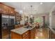 The kitchen area has a view of the dining room and features an island cooktop at 2628 Hollow Pne, Conyers, GA 30094