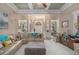 Spacious living room with coffered ceiling, neutral tones, and an open floor plan perfect for entertaining and relaxation at 2628 Hollow Pne, Conyers, GA 30094