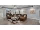 Spacious living room with hardwood floors, modern fireplace, large sofa and elegant decor at 2628 Hollow Pne, Conyers, GA 30094