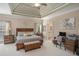Spacious primary bedroom features a tray ceiling and en-suite bathroom at 2628 Hollow Pne, Conyers, GA 30094