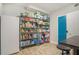 Organized pantry with metal shelving for food and storage, plus washer and dryer at 2628 Hollow Pne, Conyers, GA 30094
