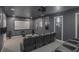 Home theater room with tiered seating, projector, and surround sound system for entertainment at 2628 Hollow Pne, Conyers, GA 30094
