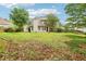 Large backyard with mature trees and grass at 3641 Willow Club Dr, Loganville, GA 30052