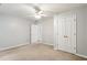 A roomy bedroom featuring neutral walls, carpet, and a ceiling fan at 3641 Willow Club Dr, Loganville, GA 30052