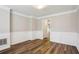 The dining room has beautiful molding, wainscoting, and flooring at 3641 Willow Club Dr, Loganville, GA 30052