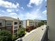 Balcony featuring a neighborhood view with tree-lined street and clear blue sky at 390 17Th Nw St # 6001, Atlanta, GA 30363
