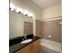 Bathroom with large mirror, vanity, and a shower-tub combination with tile surround at 390 17Th Nw St # 6001, Atlanta, GA 30363