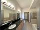 A modern bathroom includes double sinks, a soaking tub, and a separate shower at 390 17Th Nw St # 6001, Atlanta, GA 30363