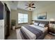 Modern bedroom featuring a ceiling fan, large window, and contemporary decor at 390 17Th Nw St # 6001, Atlanta, GA 30363