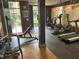 Community gym with workout machines and weights overlooking outside treeline at 390 17Th Nw St # 6001, Atlanta, GA 30363