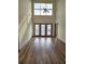 Spacious living room with high ceilings, large windows, and wood-look floors at 390 17Th Nw St # 6001, Atlanta, GA 30363
