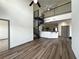Open-concept living area showcasing hardwood floors, spiral staircase and an eat-in kitchen with bar seating at 390 17Th Nw St # 6001, Atlanta, GA 30363
