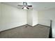 Carpeted loft space featuring a ceiling fan and natural light with great potential for customization at 390 17Th Nw St # 6001, Atlanta, GA 30363