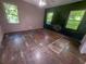 Bedroom with hardwood floors and windows, showing signs of water damage at 668 Lynn Sw Cir, Atlanta, GA 30311