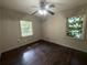 Bedroom featuring hardwood floors, neutral walls, and two windows at 668 Lynn Sw Cir, Atlanta, GA 30311