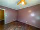 This bedroom has hardwood floors and a ceiling fan at 668 Lynn Sw Cir, Atlanta, GA 30311
