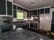 Kitchen featuring black cabinets, countertop, and appliances at 668 Lynn Sw Cir, Atlanta, GA 30311