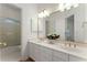 Bright bathroom featuring double sinks, lots of counter space and a large mirror at 1575 Wynridge Pointe, Alpharetta, GA 30005