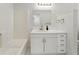 Bathroom features a vanity with gold fixtures and a white shower and bathtub at 1575 Wynridge Pointe, Alpharetta, GA 30005