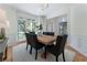 Formal dining area with modern light fixture, hardwood floors, and a large window for ample natural light at 1575 Wynridge Pointe, Alpharetta, GA 30005