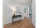 Entryway with hardwood floors, console table, and decorative mirror at 1575 Wynridge Pointe, Alpharetta, GA 30005