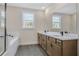 Bright bathroom showcasing a glass-enclosed shower, soaking tub, and double sink vanity with white countertops at 2560 Silver Star Ne Dr, Marietta, GA 30066