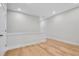Bright upper hallway with white walls and hardwood floors, bathed in natural light at 2560 Silver Star Ne Dr, Marietta, GA 30066