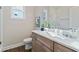 Bathroom featuring a single vanity, quartz countertop and glass-enclosed shower with tile surround and modern lighting at 2610 Lisa Sw Dr, Atlanta, GA 30311
