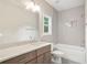 A bathroom featuring modern tile, white cabinets, light countertops, and modern fixtures at 2610 Lisa Sw Dr, Atlanta, GA 30311