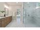 Modern bathroom with marble floors, glass-enclosed shower, and double vanity with wood cabinets, a luxurious space at 2610 Lisa Sw Dr, Atlanta, GA 30311
