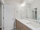 A full bathroom with a double vanity, quartz countertops, and modern fixtures at 2610 Lisa Sw Dr, Atlanta, GA 30311