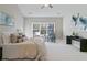 Serene bedroom featuring a large window, soft carpet, and stylish decor, creating a cozy retreat at 2610 Lisa Sw Dr, Atlanta, GA 30311