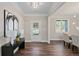 Welcoming foyer with hardwood floors, elegant lighting, and an entryway to the dining room at 2610 Lisa Sw Dr, Atlanta, GA 30311