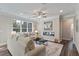 Comfortable living room featuring hardwood floors, a modern fireplace, and natural light at 2610 Lisa Sw Dr, Atlanta, GA 30311