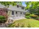 Charming backyard with a patio and lush greenery, perfect for outdoor relaxation and entertaining at 4774 Olde Village Ln, Atlanta, GA 30338