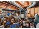 Cluttered unfinished basement showcasing storage and utility equipment at 4774 Olde Village Ln, Atlanta, GA 30338