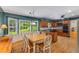 Dining area with wood floors and large windows offering ample natural light at 4774 Olde Village Ln, Atlanta, GA 30338