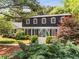 Charming two-story home with lush landscaping and a welcoming front entrance at 4774 Olde Village Ln, Atlanta, GA 30338