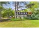 Beautifully landscaped home with manicured shrubs and trees, featuring a welcoming front facade and curb appeal at 4774 Olde Village Ln, Atlanta, GA 30338