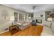 Cozy living room with hardwood floors, built-in shelving, and a fireplace, creating a warm, inviting atmosphere at 4774 Olde Village Ln, Atlanta, GA 30338
